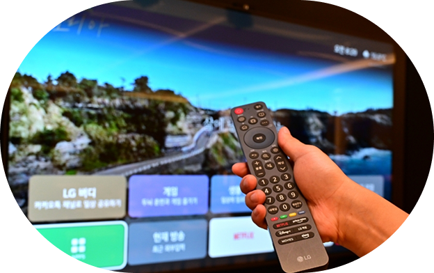A scene of holding a remote control with large text while operating a TV screen showing a simple interface with large text and icons