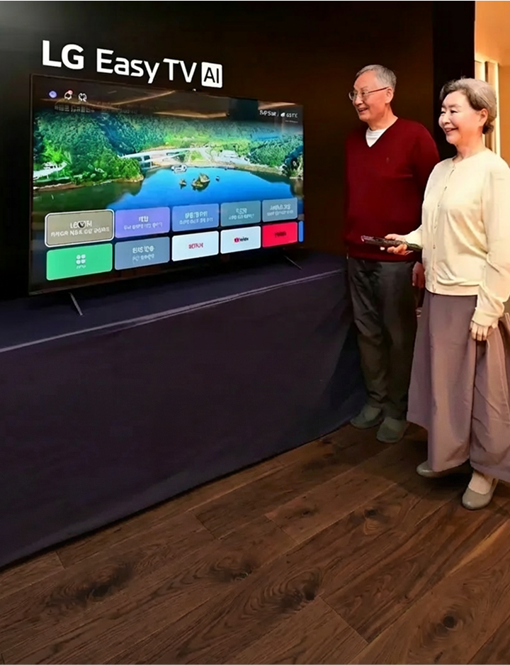 A scene of holding a remote control with large text while operating a TV screen showing a simple interface with large text and icons
