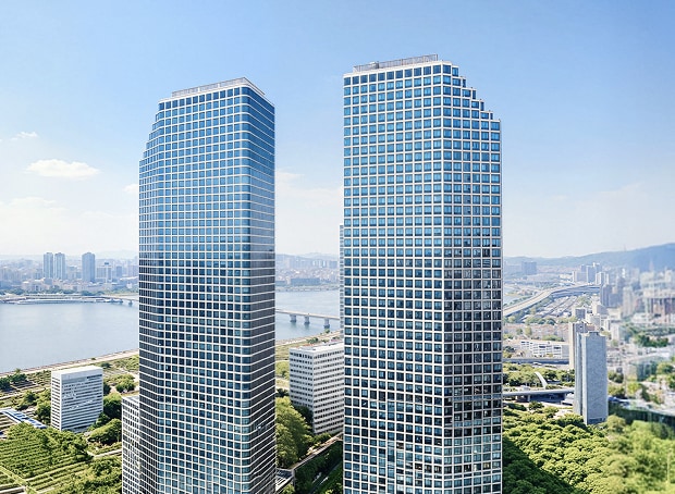 A background image displaying a wide view of the Han River and the downtown skyline under a clear sky. Positioned on the right side of the screen are the LG Twin Towers, consisting of two adjacent high-rise buildings with full glass facades.