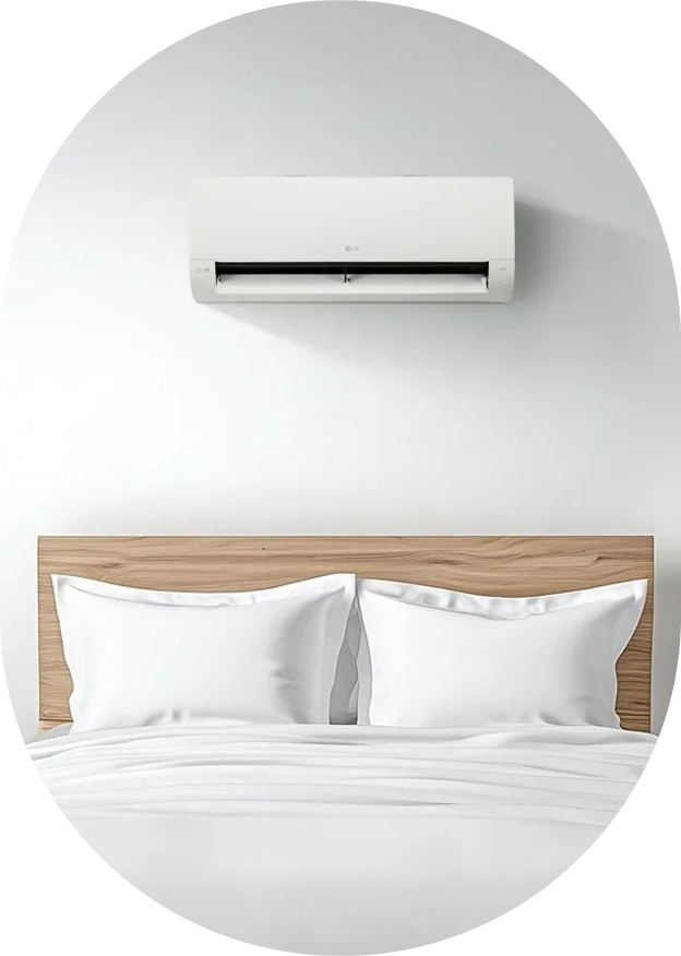 A white LG WHISEN Objet Collection Wall-Mounted Air Conditioner installed on a bedroom wall
