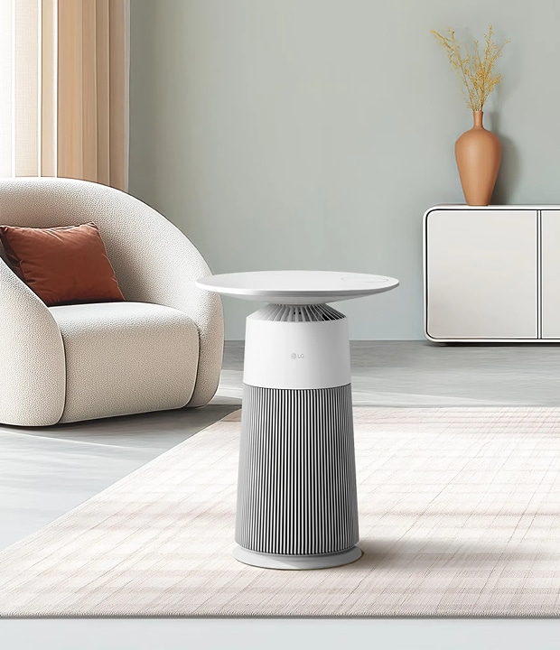 A living room scene with a Aero Furniture placed on the floor, with a sofa and a cabinet positioned in the background