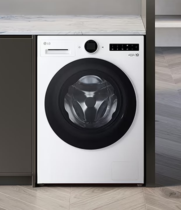 A front-loading washing machine installed between cabinets, shown from the front