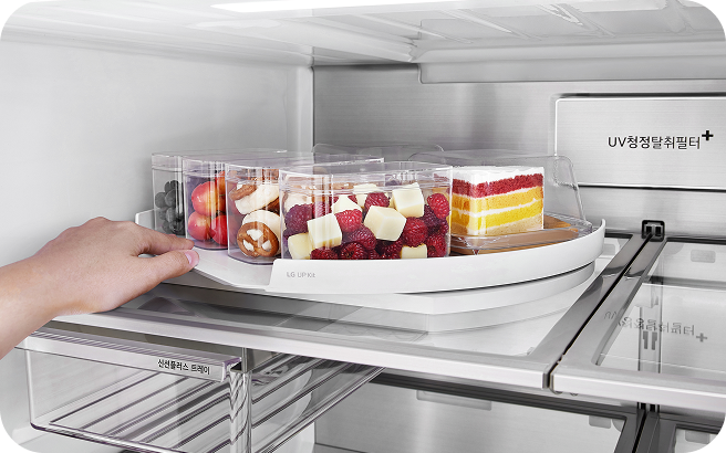Rotating refrigerator shelf that brings items stored at the back forward for easier access