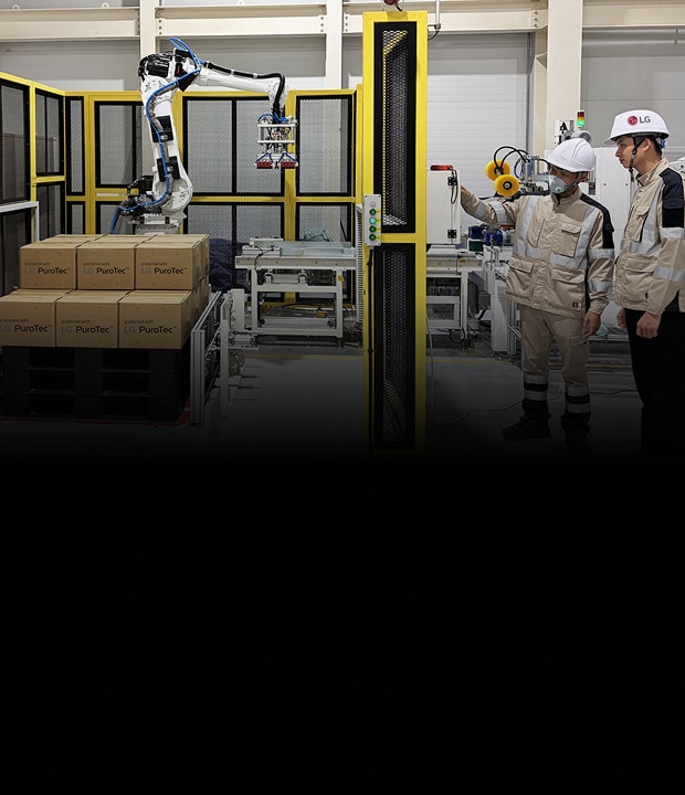 LG Electronics employees inspect an automated production line at the company's advanced glass powder materials facility in Haiphong, Vietnam, where LG PuroTec™ products are being packaged for shipment.