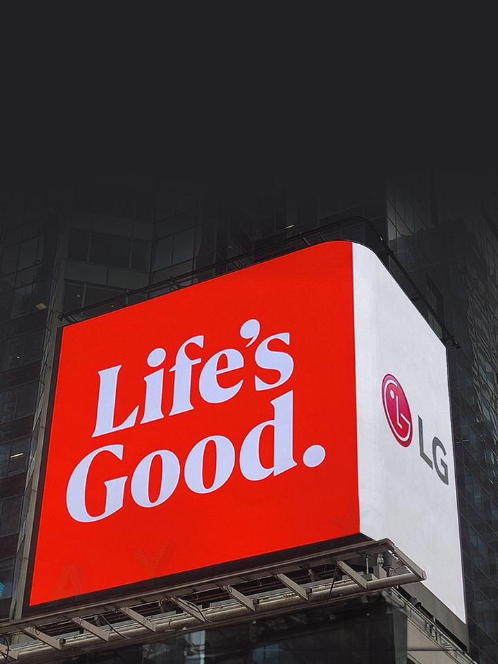 LG's logo, washing machine, and flowers are displayed on the billboard of a large building.
