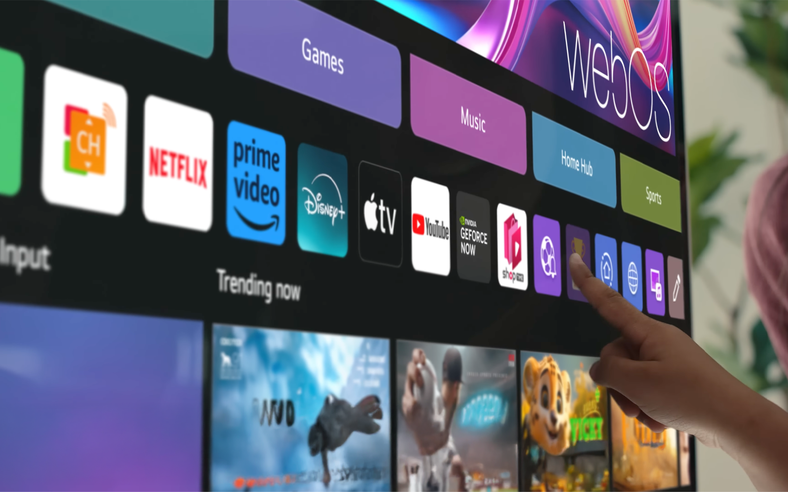 Hand touches the LG channel on an LG 360 monitor.