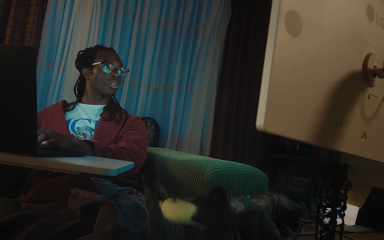 A man looks at an LG 360 monitor.