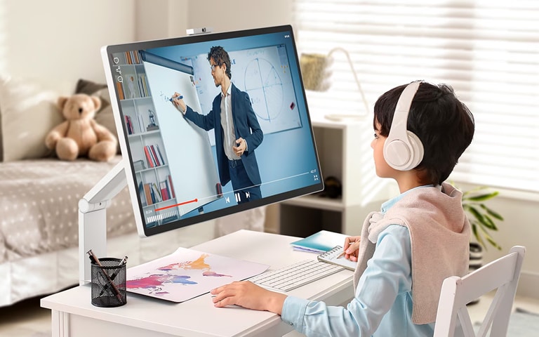 A child attends a lesson while looking at an LG 360 monitor.