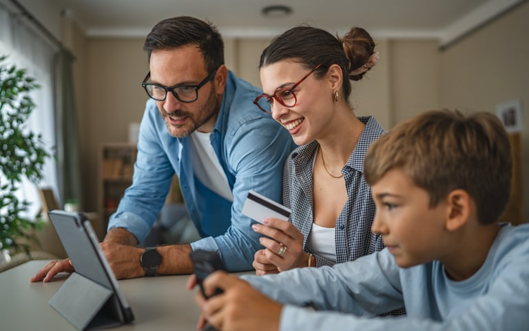 A family looking at a tablet