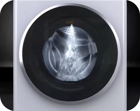 Through the glass attached to the door of the LG washing machine, you can see water pouring into the drum.