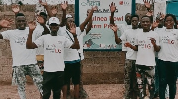 Ten people in Bangladet are waving their hands in a white LG semi t-shirt.