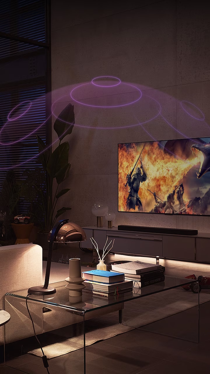 An LG OLED TV is in a cozy living room at night. As the movie plays, bubbles depicting surround appear.