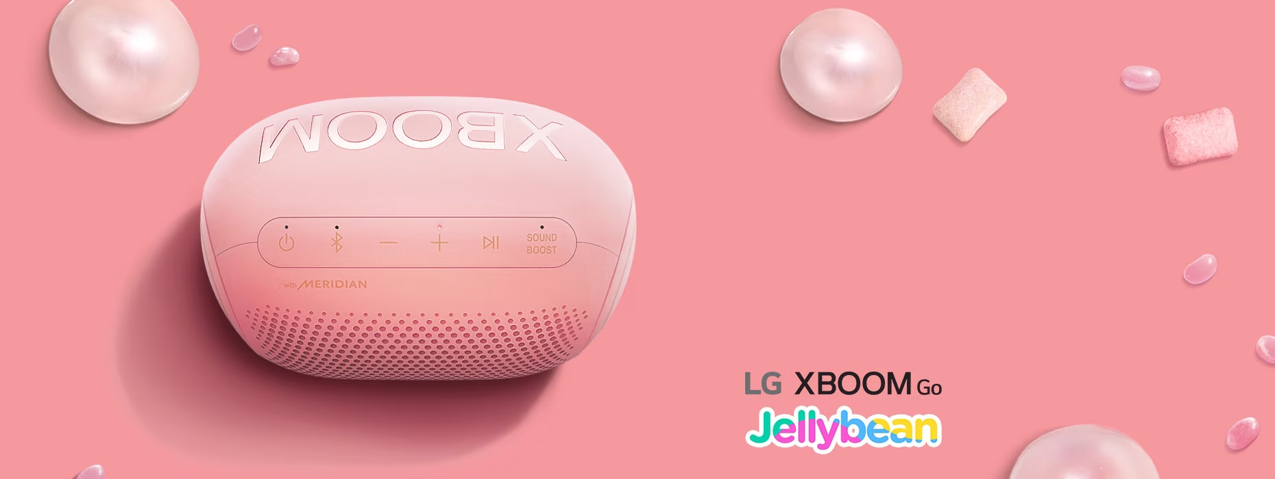 La Bocina PL2 Jellybean se muestra sobre un fondo rosa claro y gomas de mascar.