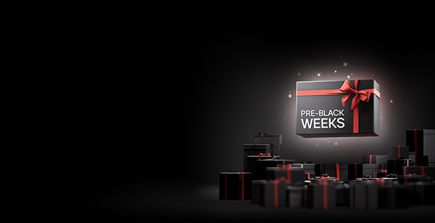 En reklambild med en svart presentask med rött band och rosett som svävar i mitten. På asken står texten "PRE-BLACK WEEKS". Bakgrunden är mörk med gnistor, och flera svarta och röda presentaskar syns längst ner i bilden. Längst ner finns Klarna-loggan och text om att handla nu och betala om 30 dagar.