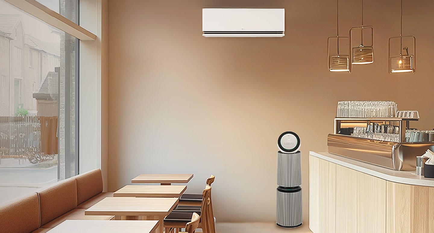 LG air conditioner and LG air purifier placed in a modern café interior providing clean air and comfortable environment