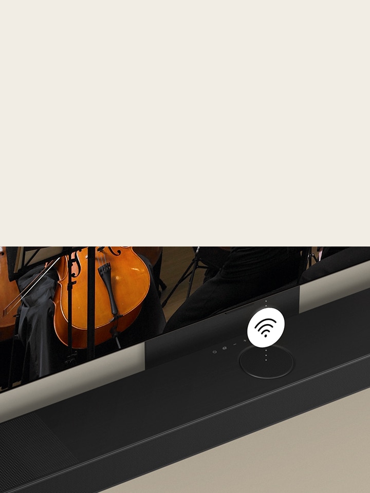 Duvara monteli LG OLED TV ve Soundbar. Ortada beyaz bir Wi-Fi sembolü grafiği yer alıyor.