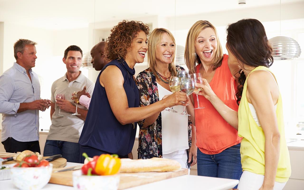 A party view which people join and smile in front of LG InstaView Door-in-door