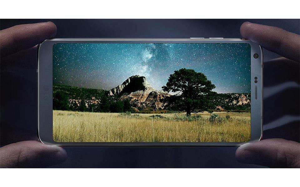 An image of hand holding lg g6 horizontally and watching beautiful video by dolby vision technology