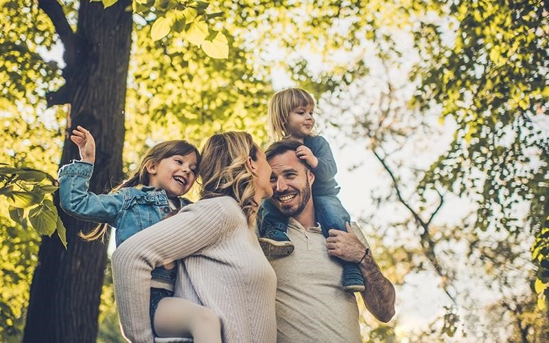 A family enjoys the stunning forest in the sun - that's our hope for the future as we work towards a more sustainable world | More at LG MAGAZINE