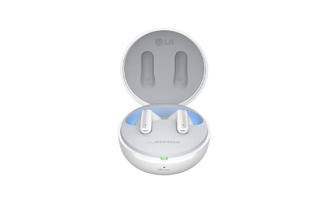 A pair of white LG TONE Free earbuds sit in an open charging case against a white background