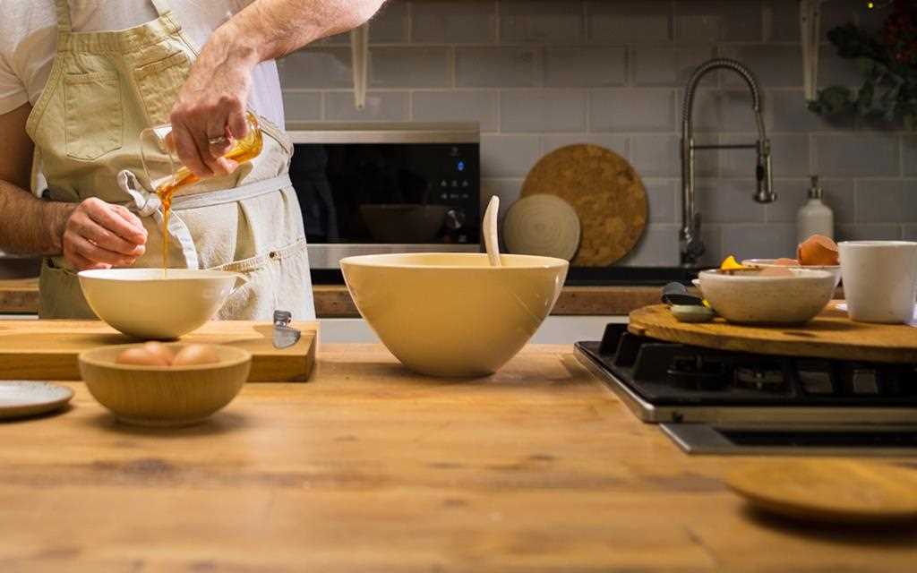 An image of a chef making a christmas pomegranate polenta cake by LG NeoChef microwave.