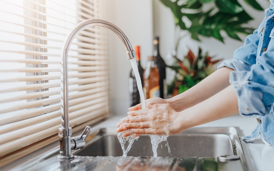 An image of a person washing hands