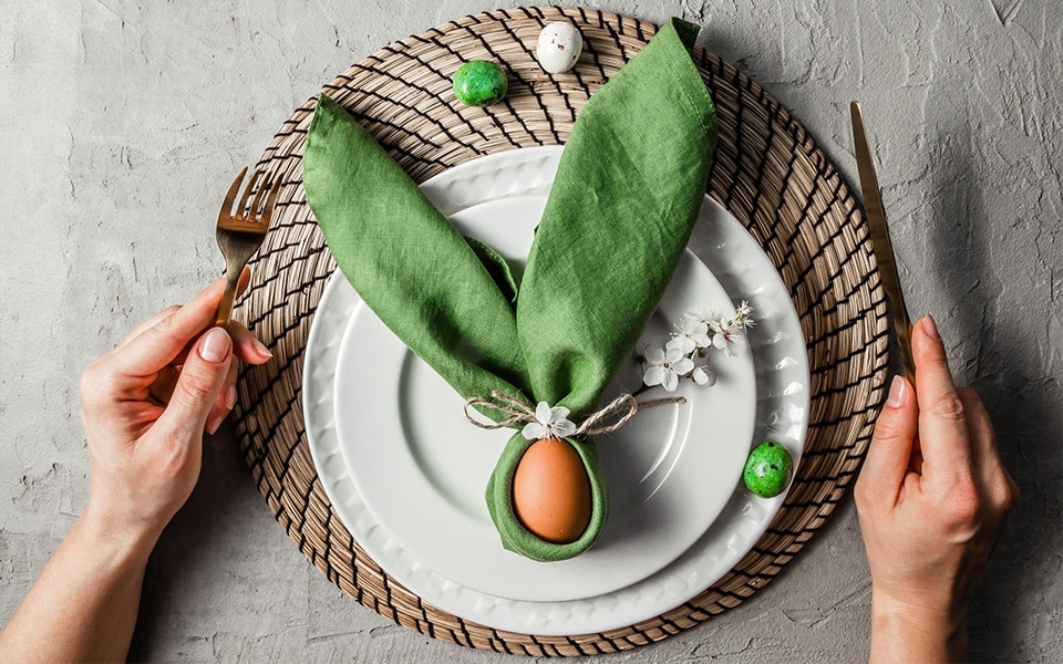 A table setting is decorated for Easter.