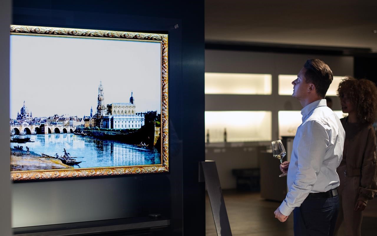 VIP guests watch the artwork rotating on the SIGNATURE OLED TV W8, on show at LG SIGNATURE ARTWEEK