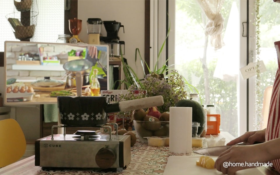 LG stanbyme in a kitchen setting with an indiviual making breakfast