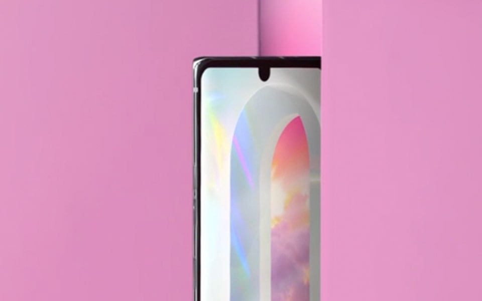 An image of the LG VELVET smartphone placed behind a pink wall