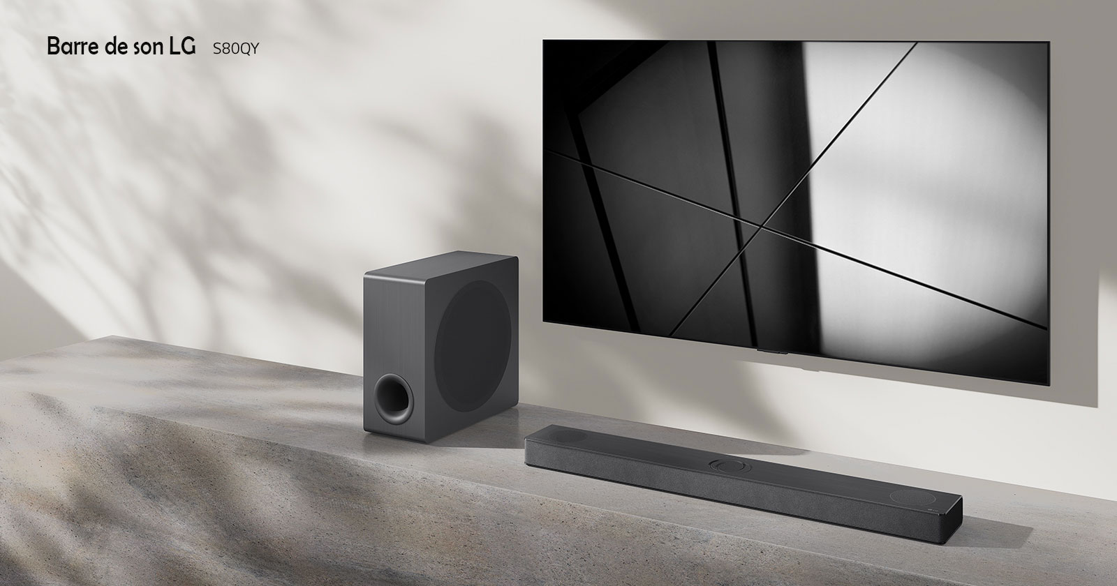 LG sound bar S65Q and LG TV are placed together in the living room. The TV is on, displaying a black and white image.