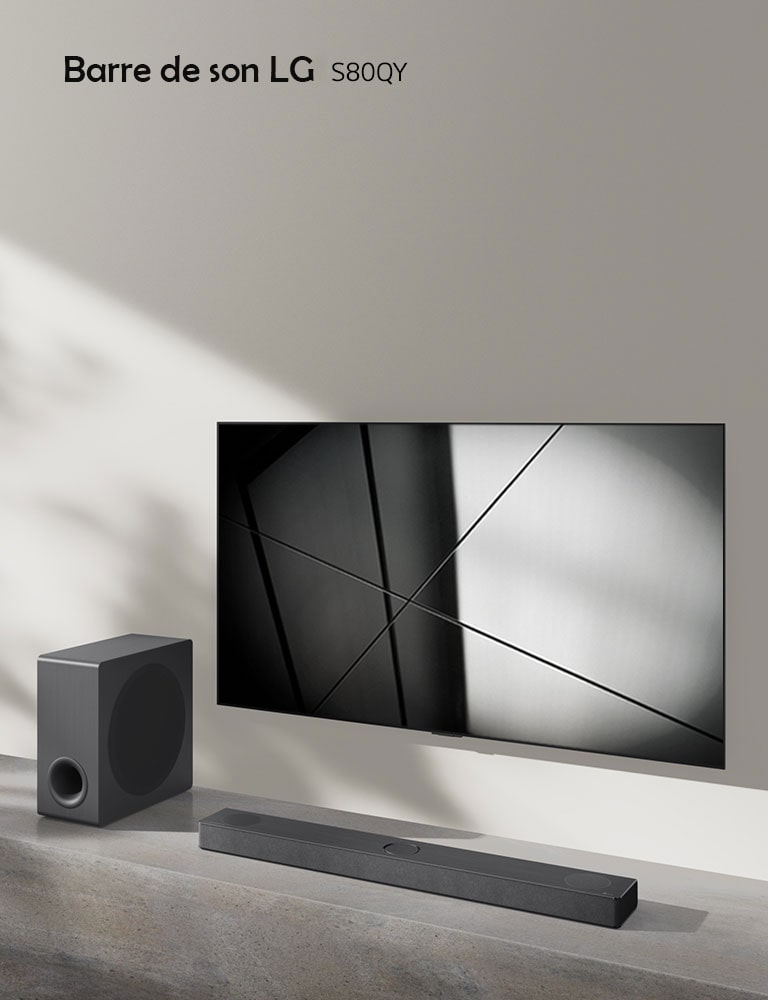 LG sound bar S65Q and LG TV are placed together in the living room. The TV is on, displaying a black and white image.