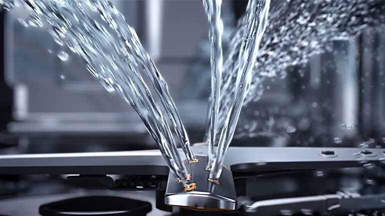 Elle montre comment l’eau est projetée dans différentes directions par le bras de lavage.