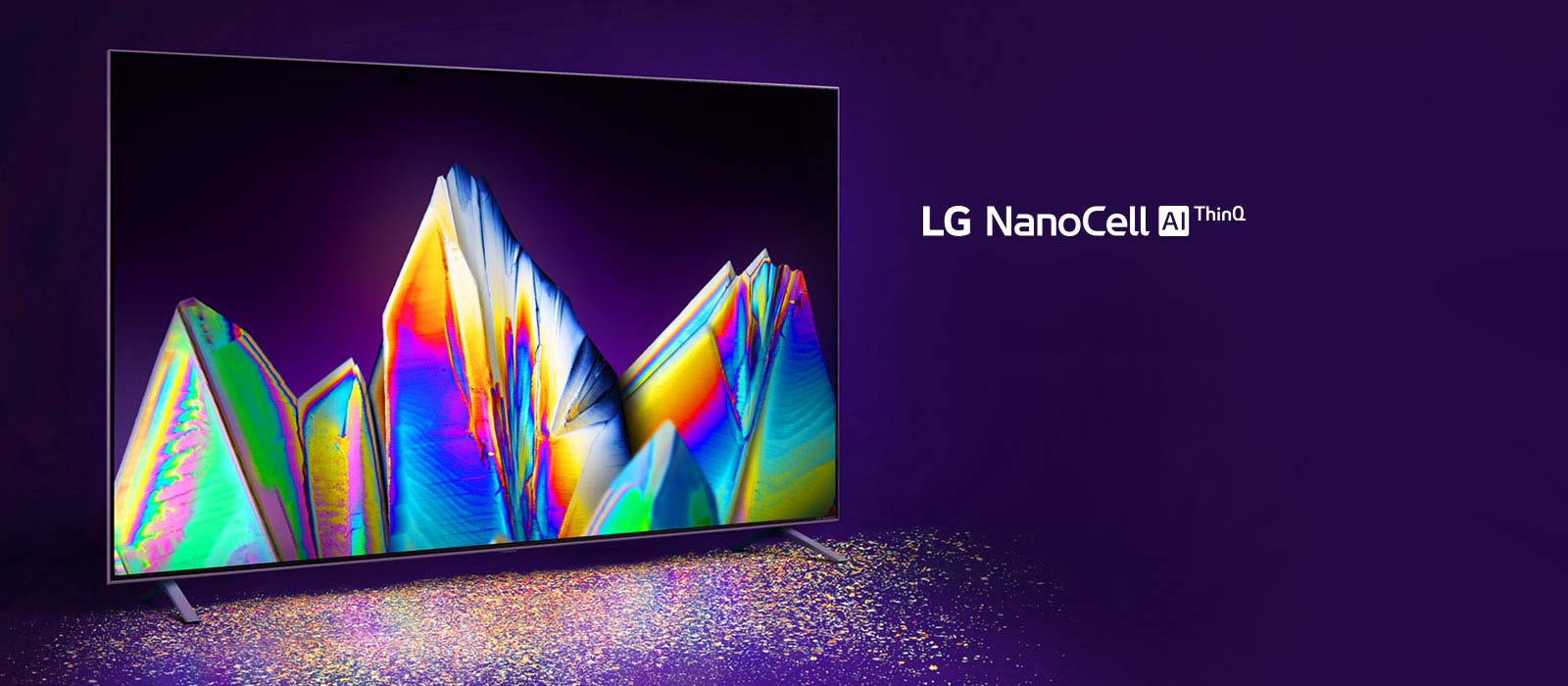 TV Nanocell avec des cristaux à l'écran. Des particules de couleur sont visibles sur le sol.