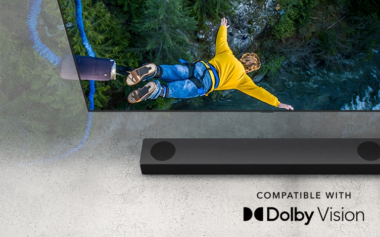 LG TV shows a person bungee jumping, and the LG Sound Bar is placed  below the TV.