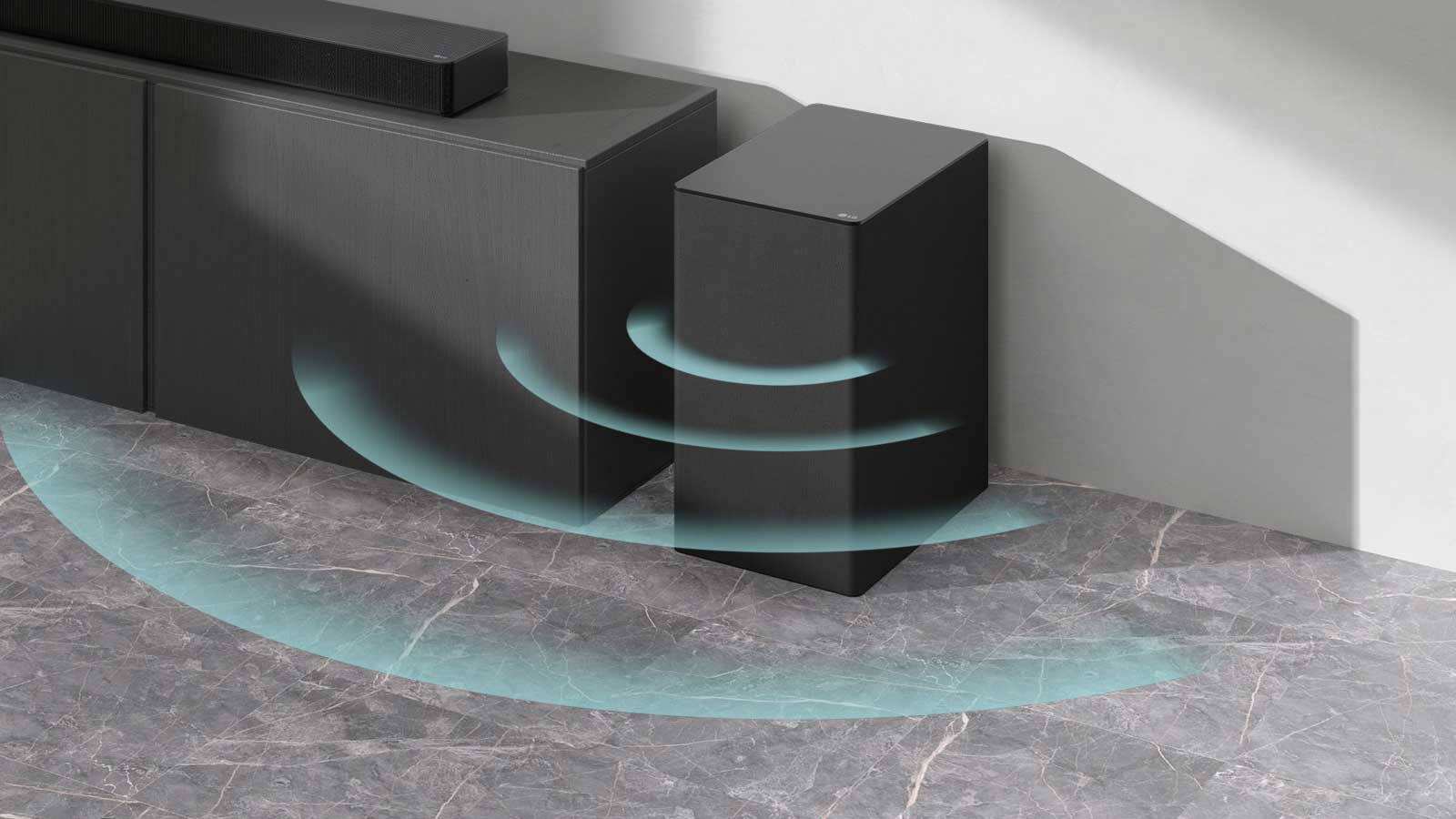 A sound bar is placed on the cabinet. Beside a wireless subwoofer placed on the floor. Blue sound graphics are coming out from the subwoofer.