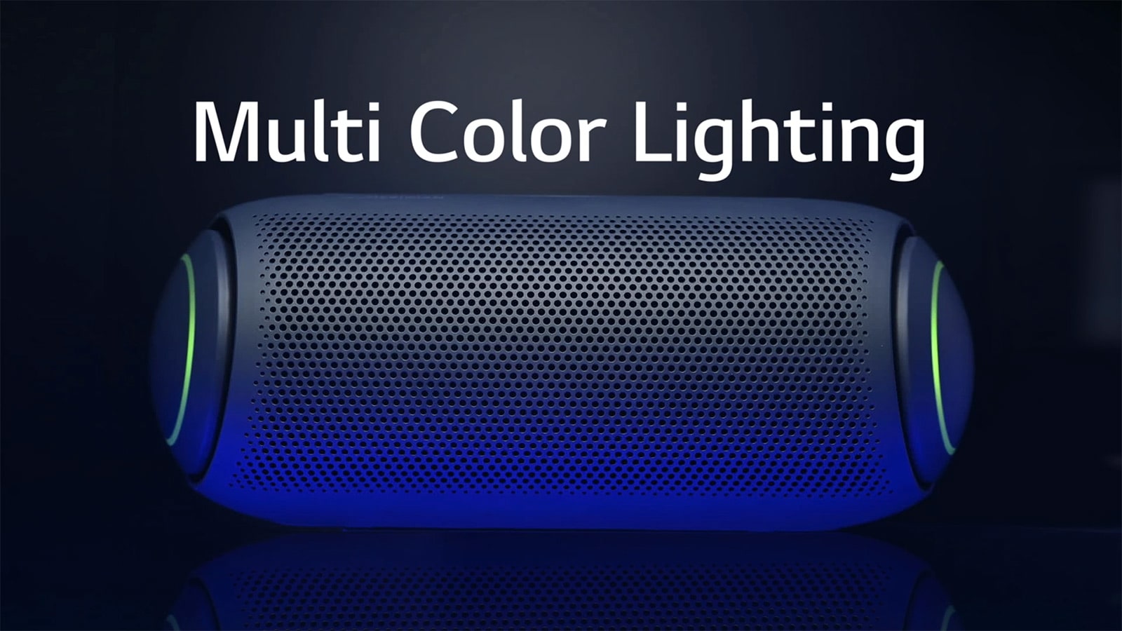 A front view of XBOOM Go with muli-colored woofer lighting on a dark background