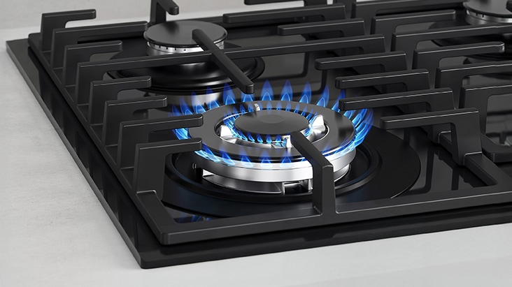 Black gas cooktop with blue flame and flame-failure safety that automatically shuts off gas.