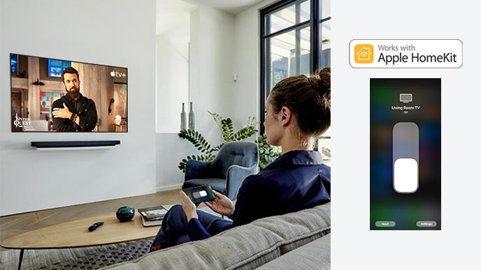A woman on the couch watching Apple TV+ content using the Apple Homekit on her cell phone (move the slide)