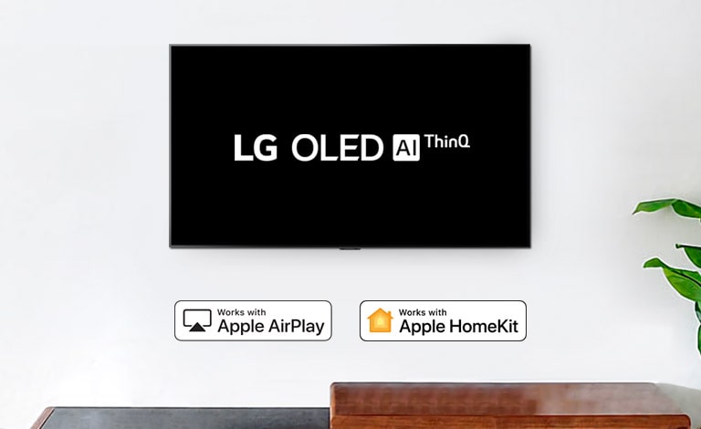 Wall-mounted TV showing LG OLED AI ThinQ logo on black background
