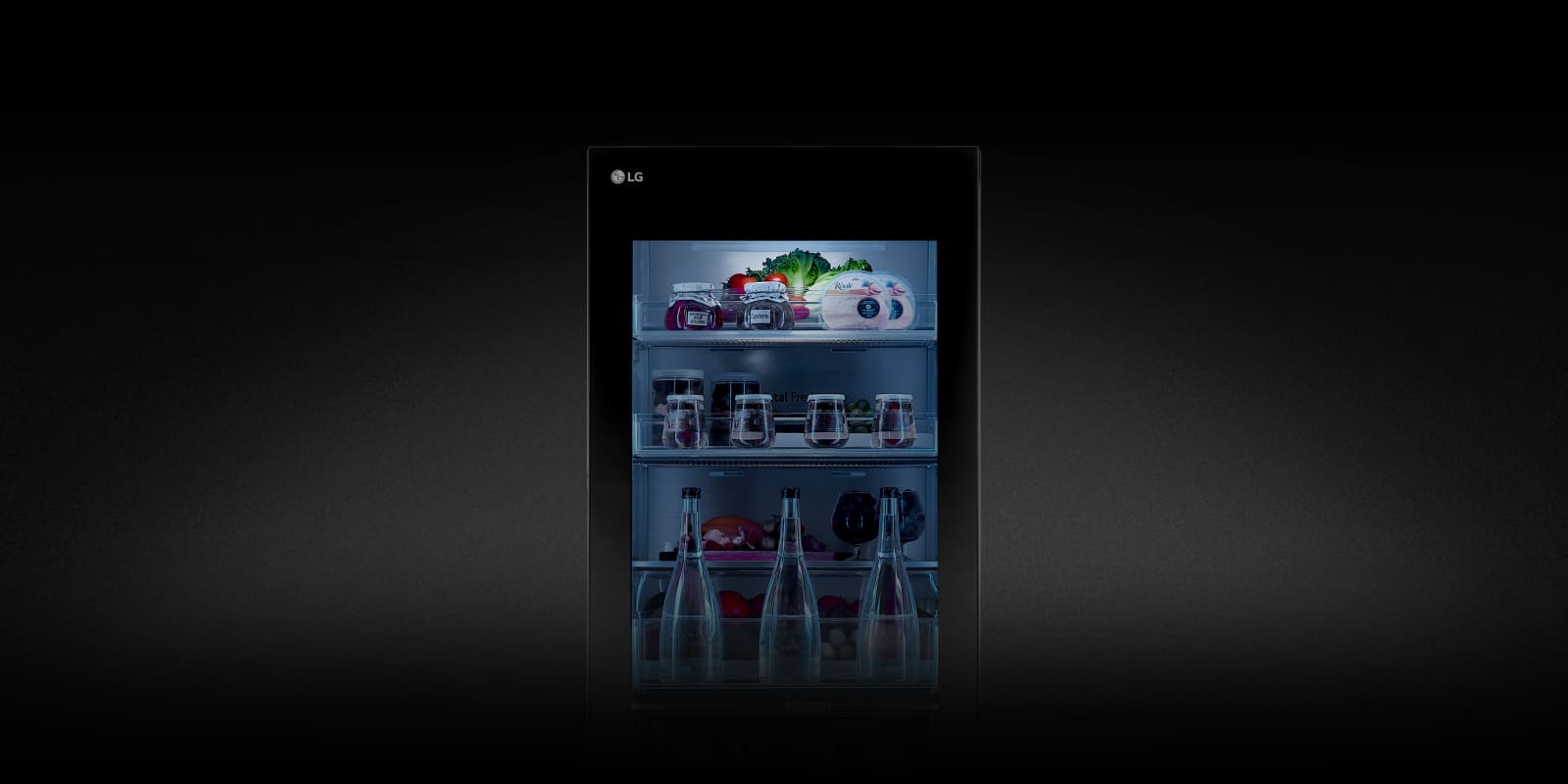 The lights on the instaview exterior of the LG bottom freezer are turned on.