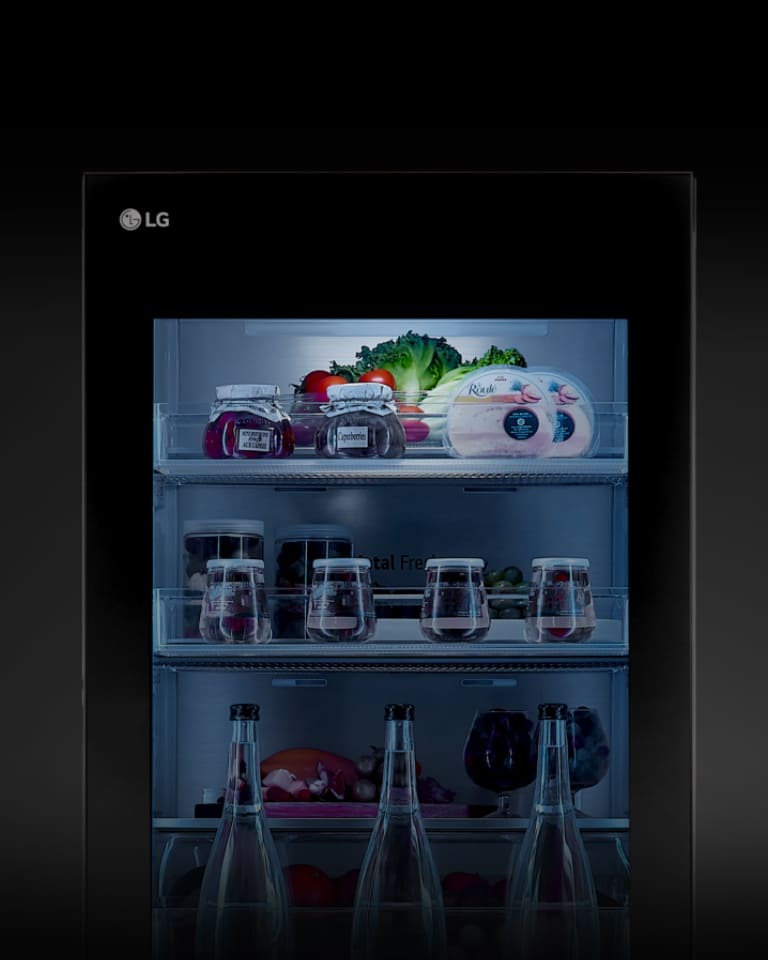 The lights on the instaview exterior of the LG bottom freezer are turned on.