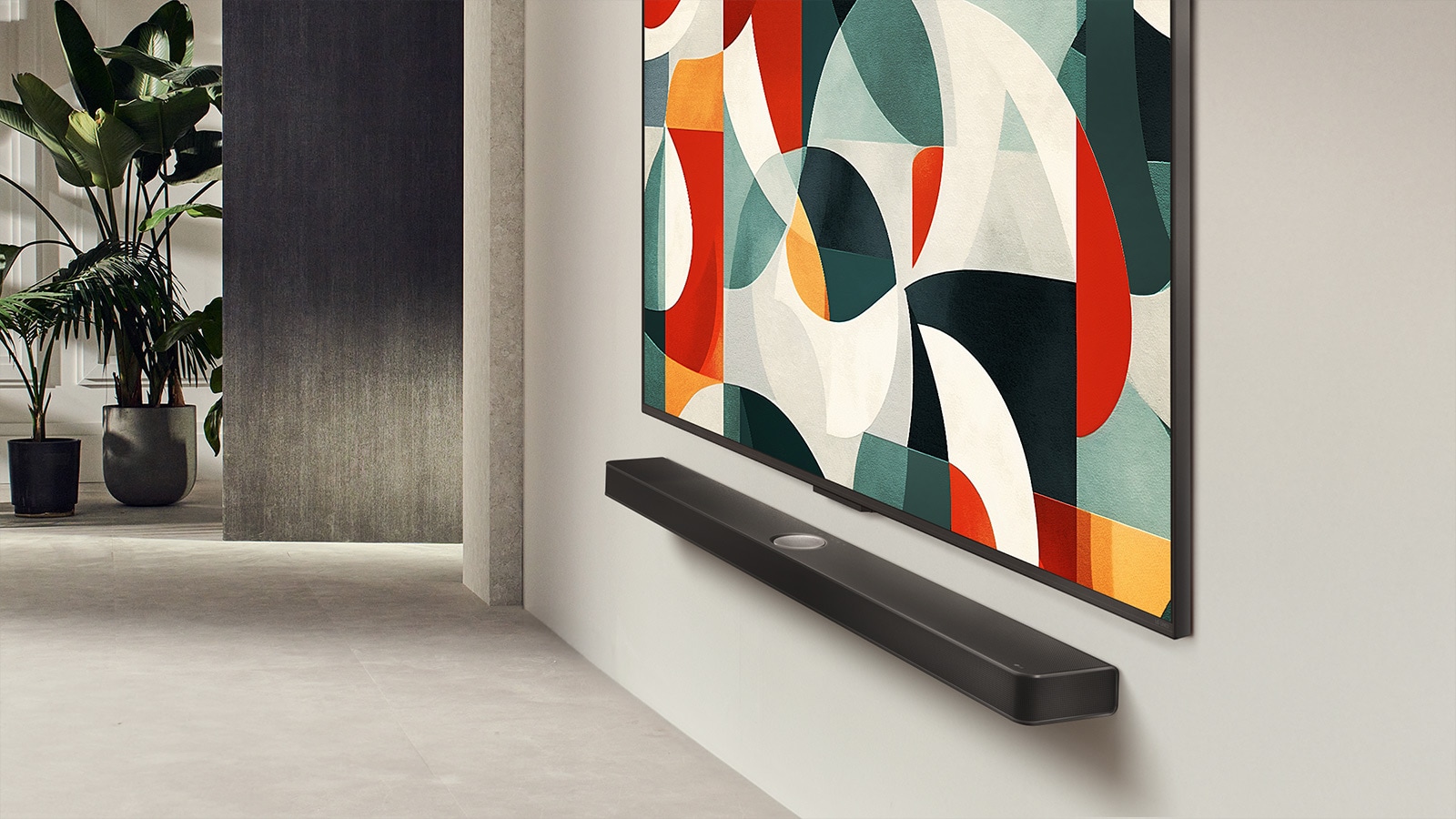 Slightly angled view of LG QNED TV mounted on a wall above a LG Soundbar in a modern living space. LG QNED TV depicts an abstract background in green, white, red and orange.