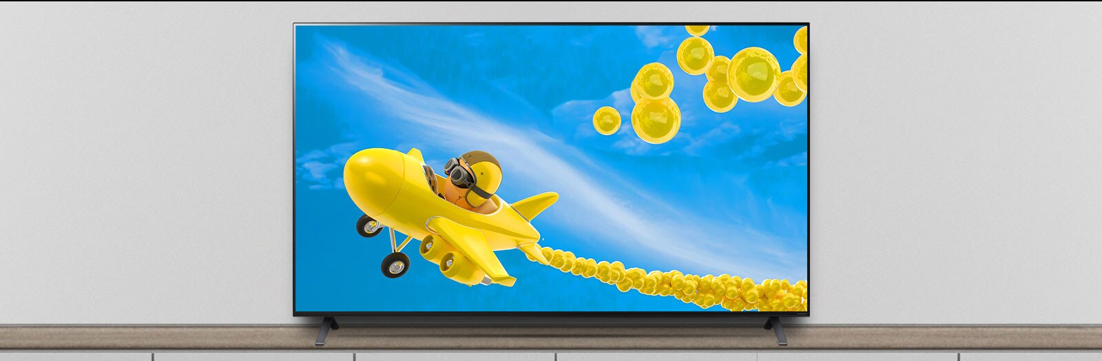 The TV is on the stand, and the screen shows an animation of an airplane flying through it.