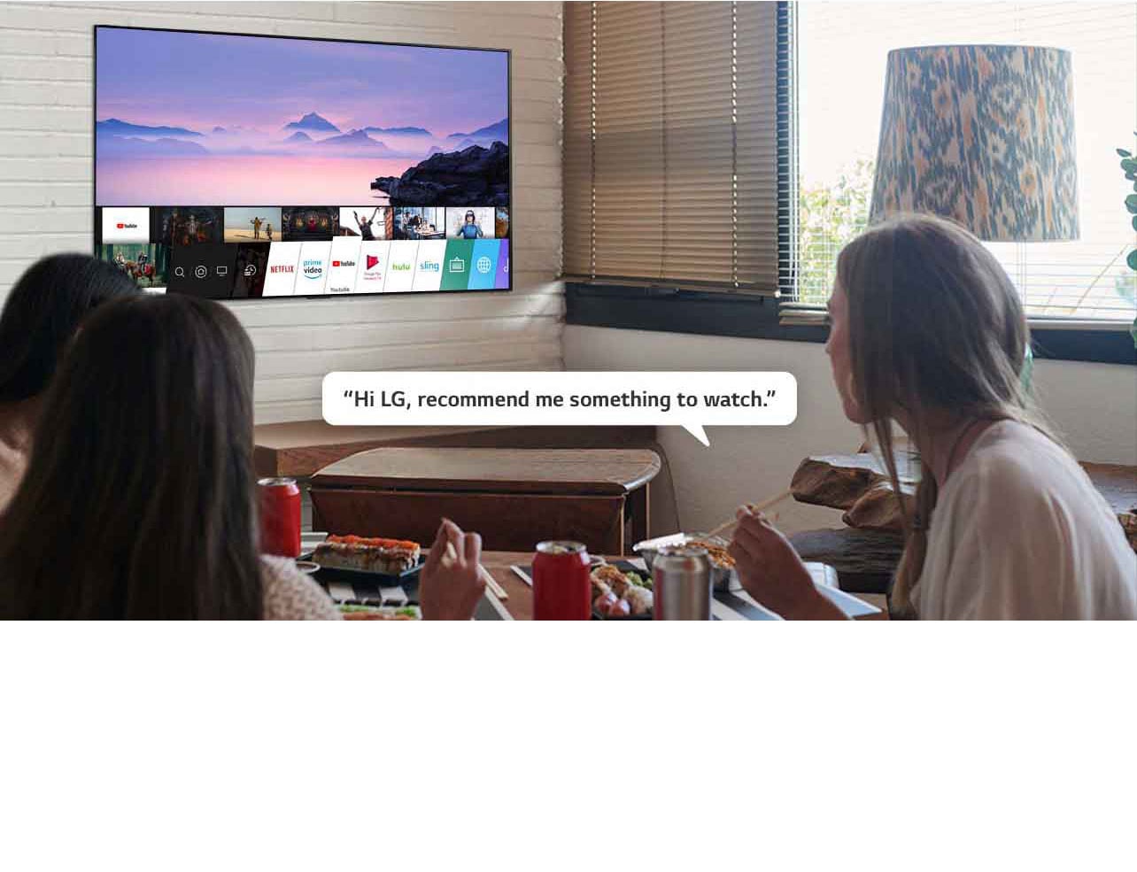 Three woman eating sushi while one of them asks LG TV recommendations to watch