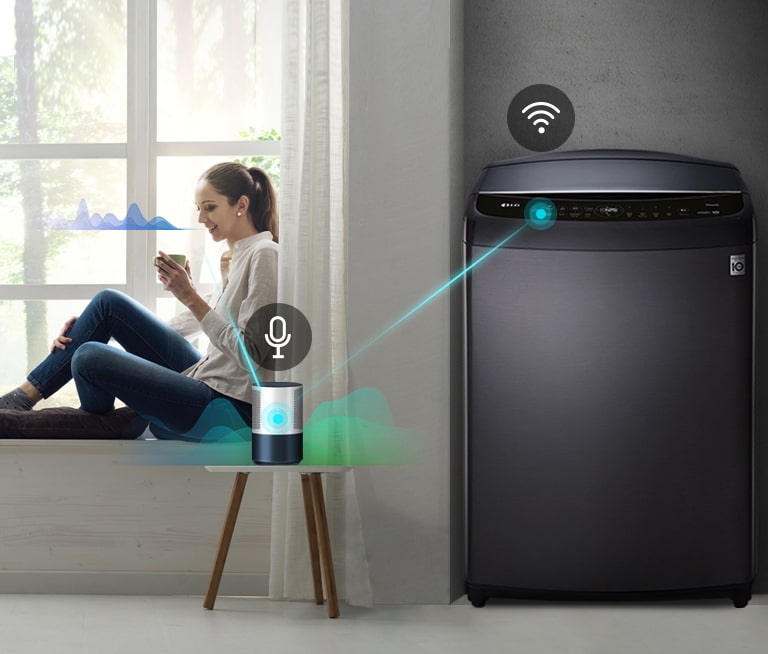 A woman sits in a window holding a drink. She speaks to the AI speaker show by a line from her to the speaker and a sound wave next to her face. The AI speaker then connects to the washer shown with a line and sound waves.