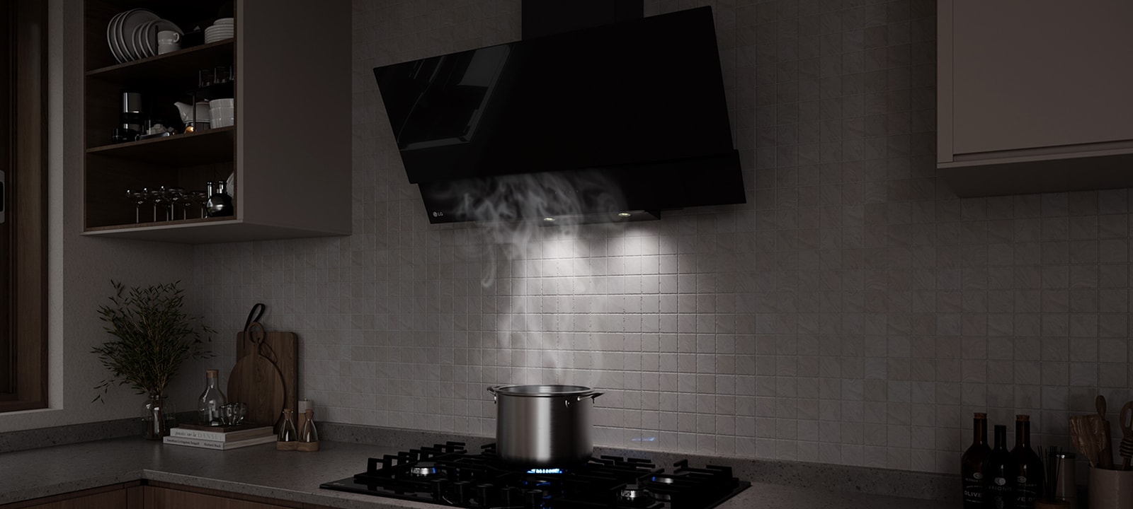 A black glass hood above a gas cooktop draws in steam rising from a pot while cooking in a modern kitchen.