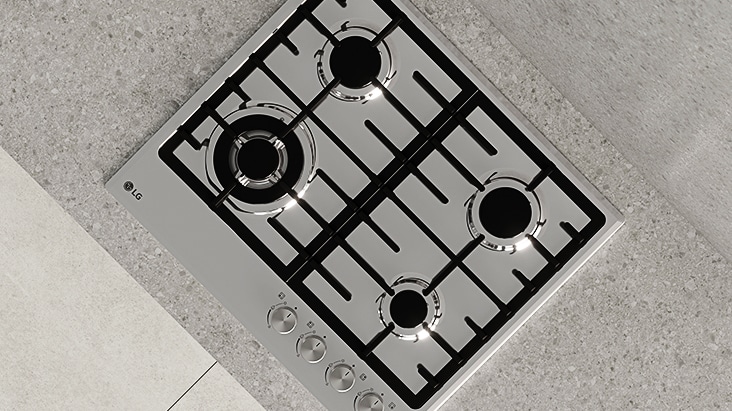 Top view of black gas cooktop with durable cast-iron grates designed for stable and secure cookware support.