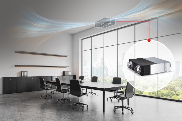 ERV is installed above the huge window in the office conference room with a desk and several chairs.