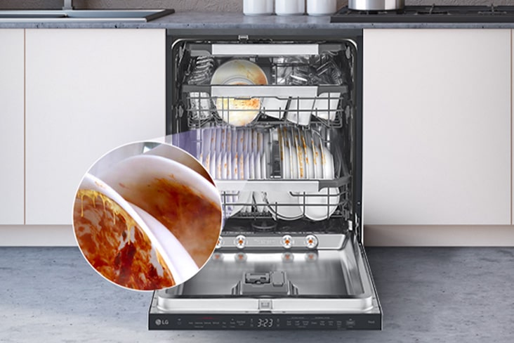 A free-standing dishwasher with the door fully open, revealing dirty dishes inside.